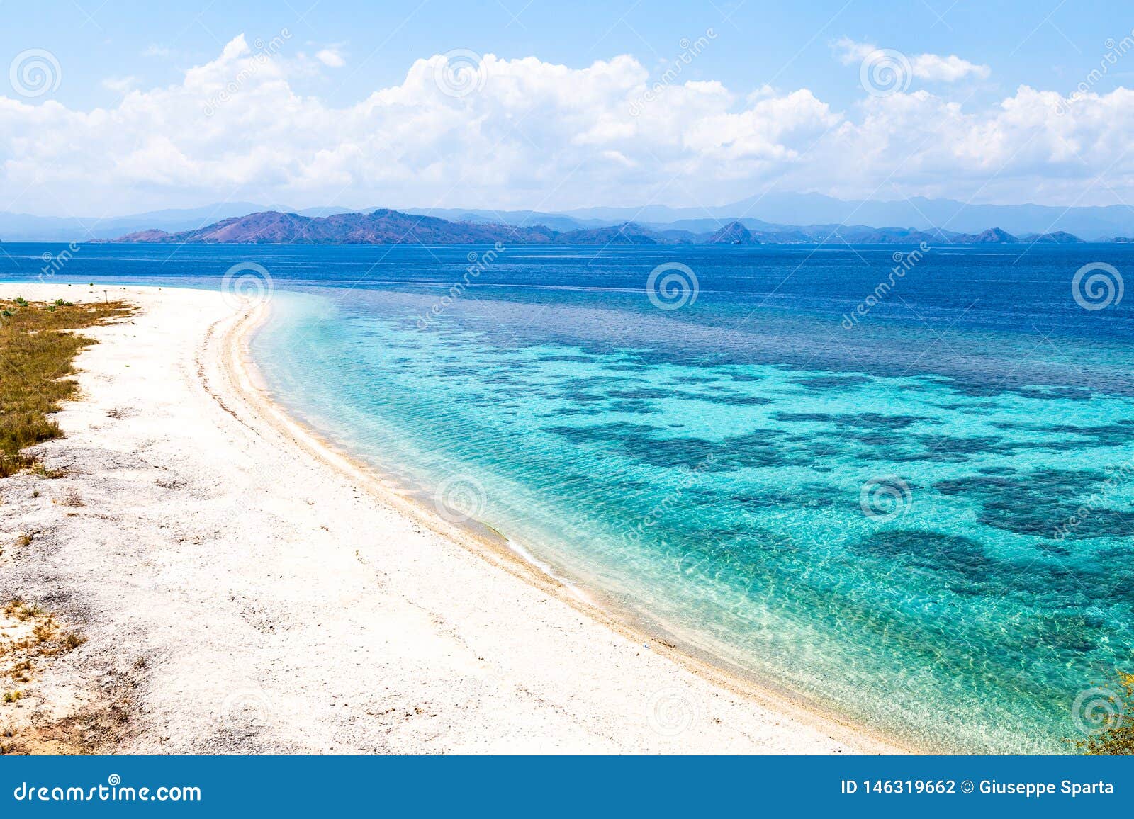 crystal clear water in sabolon besar island, one of the many island paradise spots for diving in komodo nat park