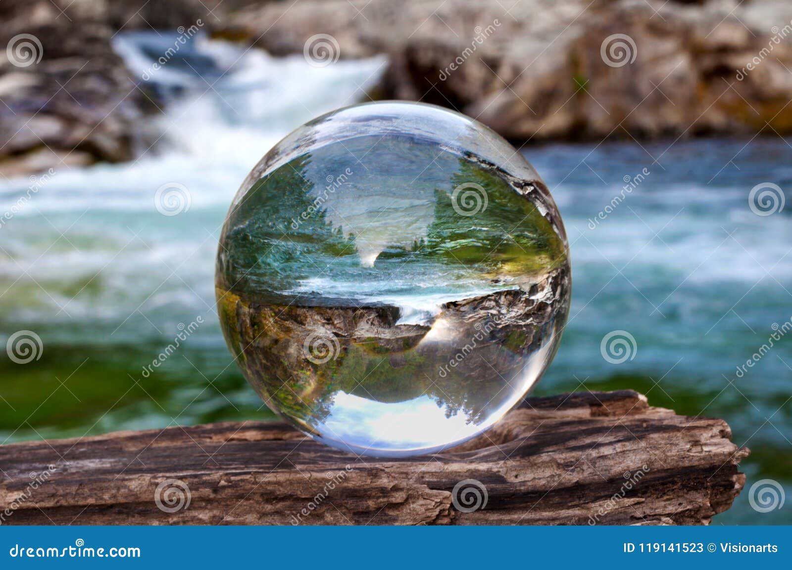 crystal glass ball sphere reveals waterfall landscape