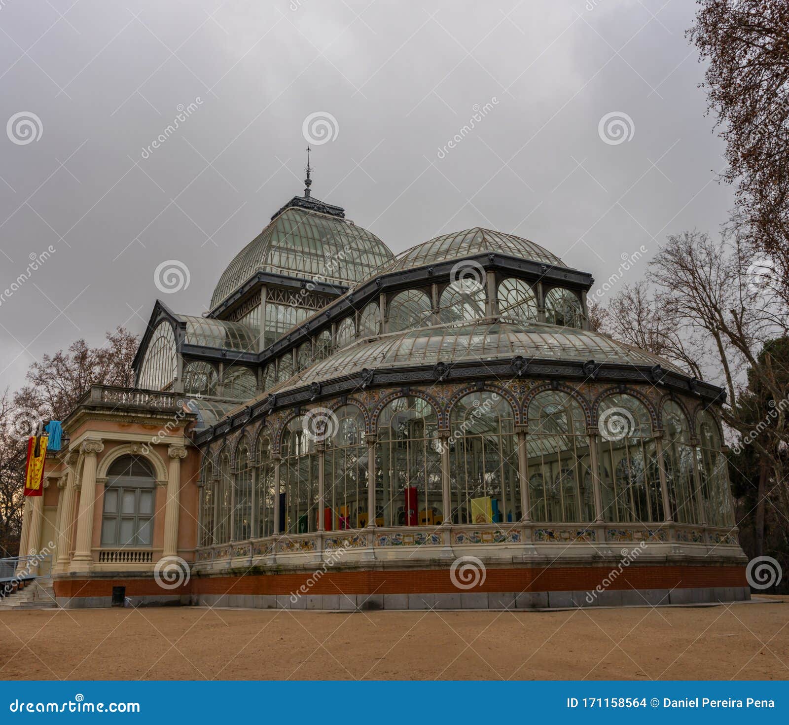 crystal palace in retiro park in madrid at dawn on a cloudy day. concepto viajes