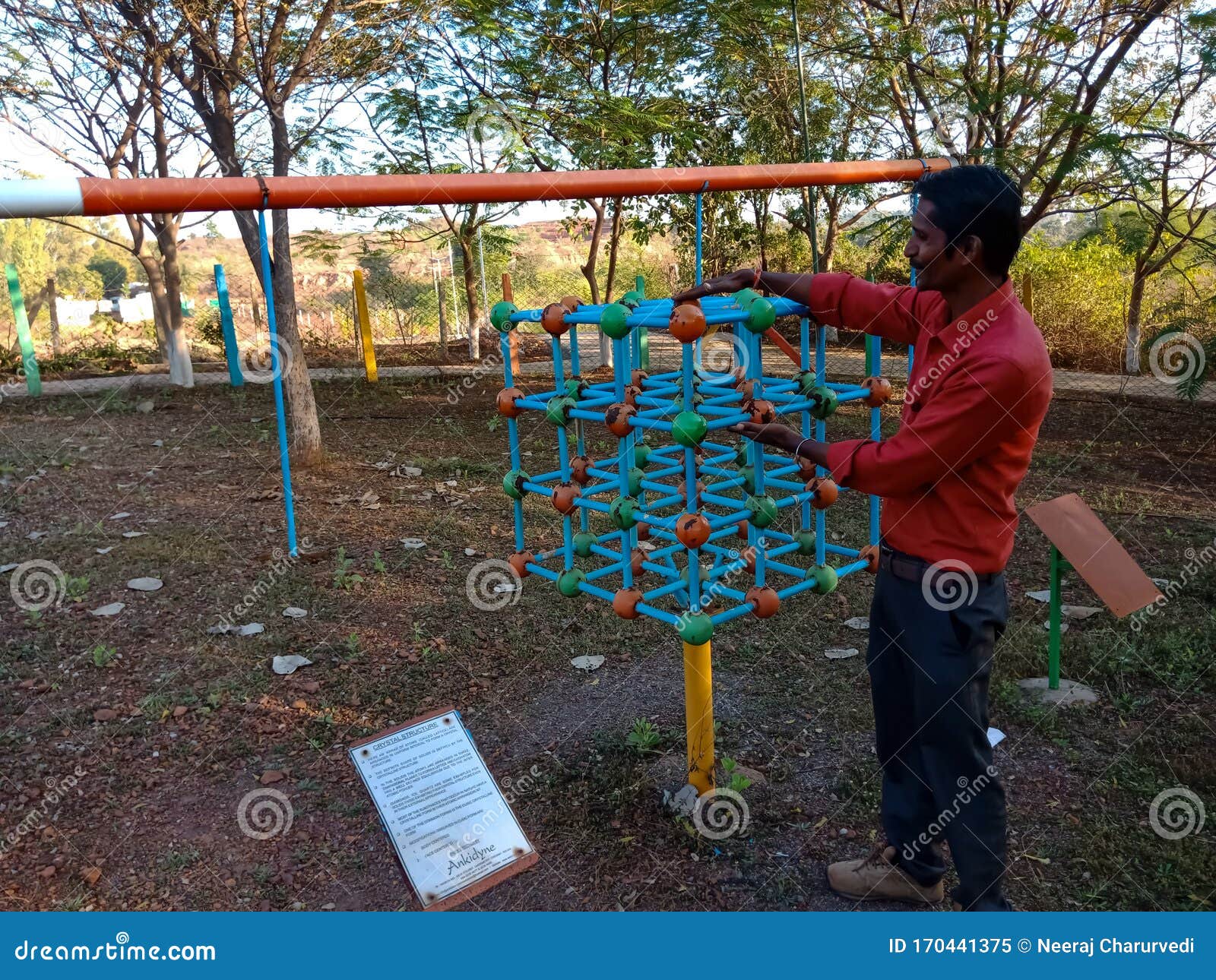 Crystal Structure Science Project Displayed in Green Park by Asian Man