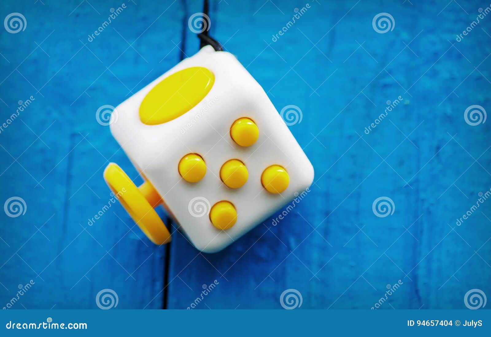 Cube Anti-stress on a Blue Background, Fidget Cube Simple Stress Editorial  Stock Image - Image of cube, spinner: 94657404