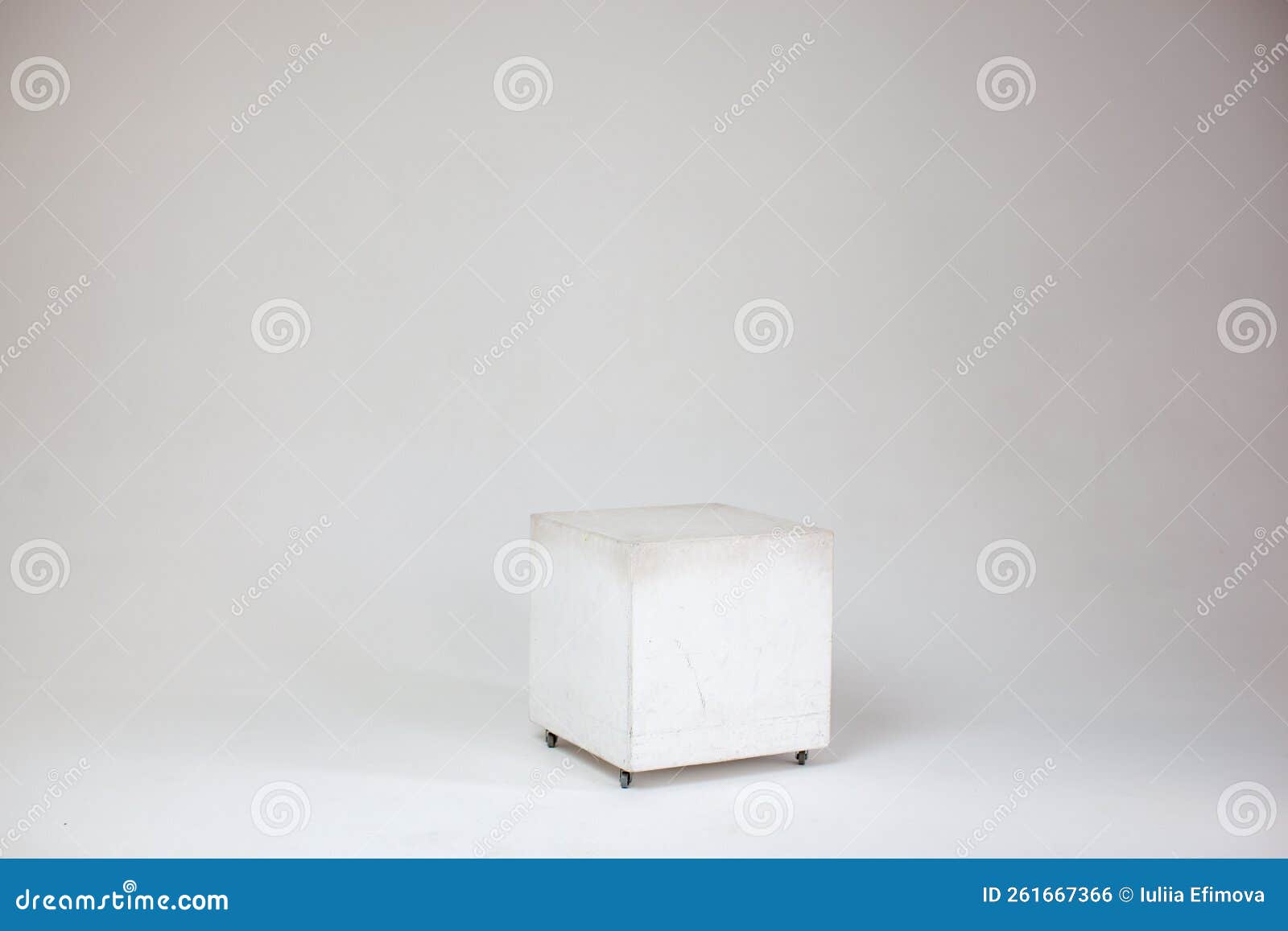 white cube on cyclorama in studio.