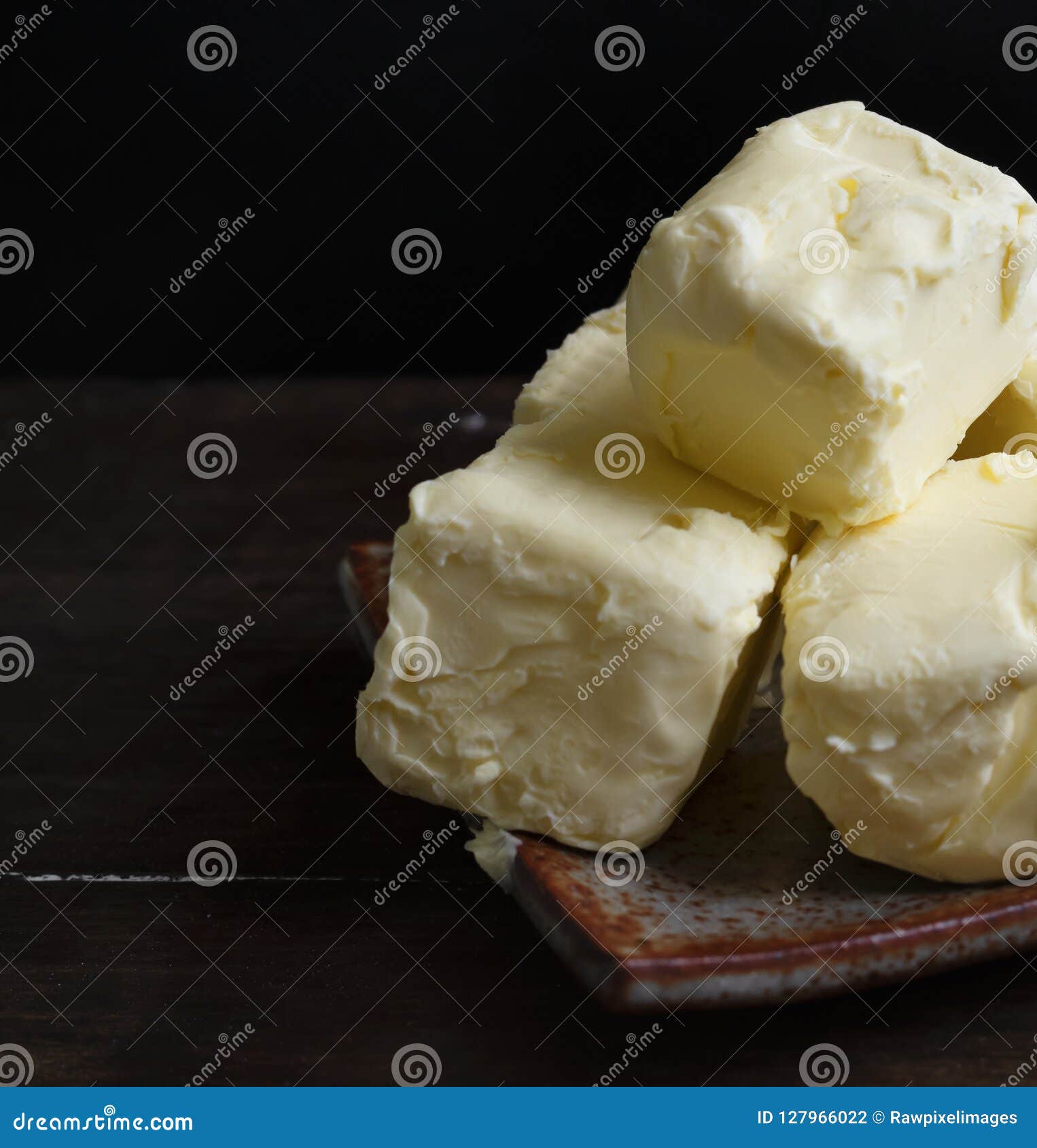 Cubes of butter on a plate stock photo. Image of food 127966022