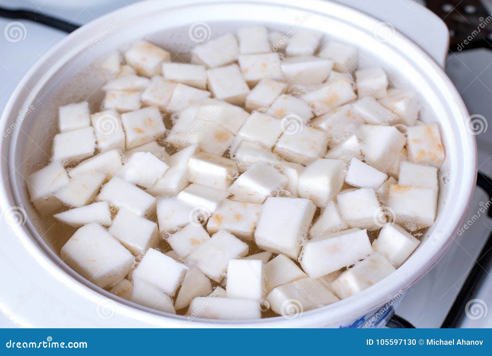 cubes of celery root in boiling water