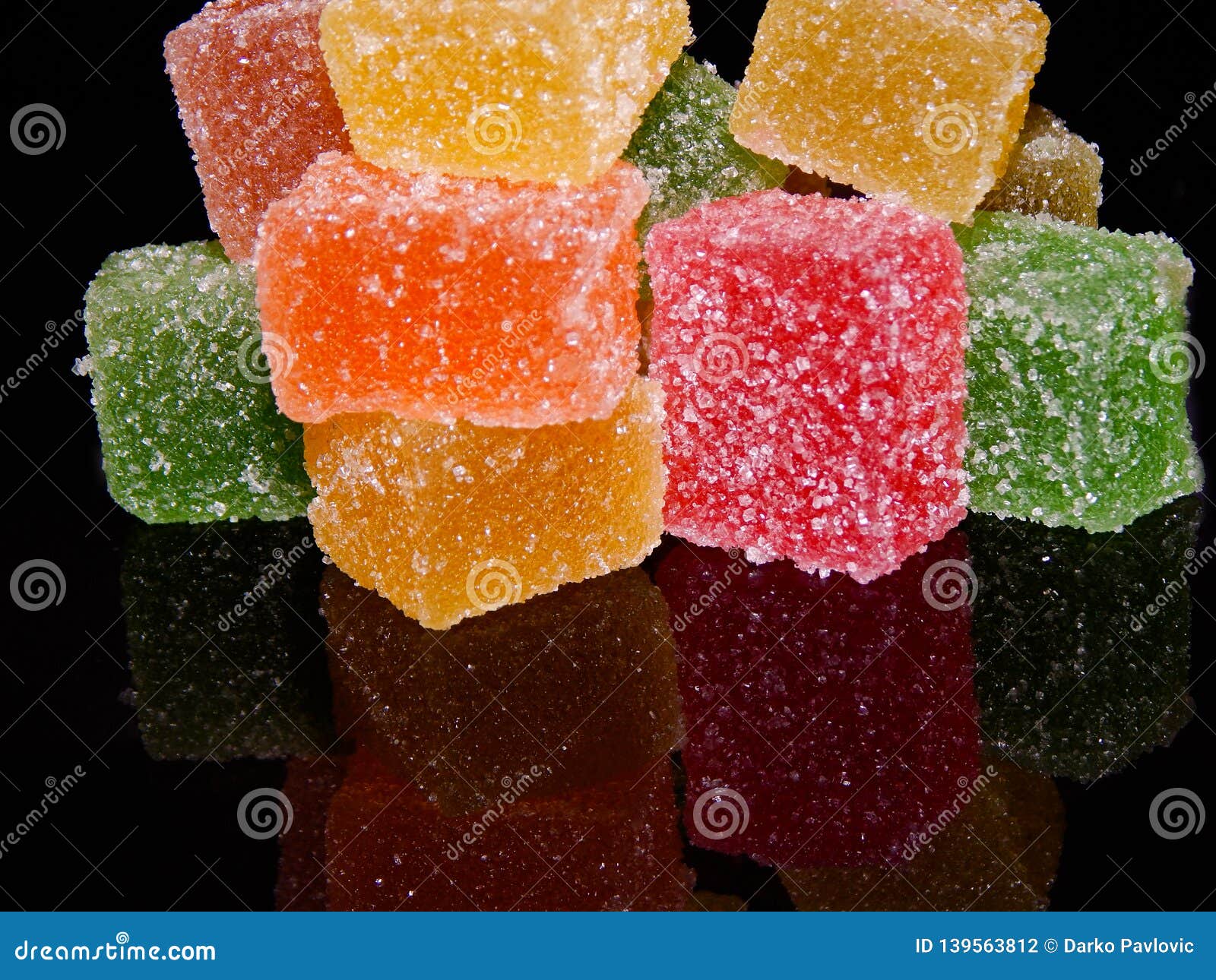 Cubes Of Jelly On A Black Reflective Background Stock Photo Image Of Jelly Cube 139563812
