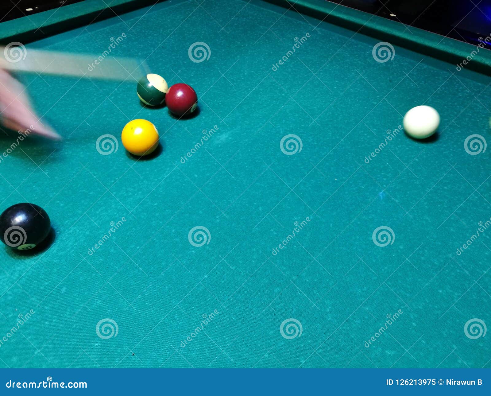cue aim billiard snooker pyramid on green table. a set of snookers/pool balls on billiards table.
