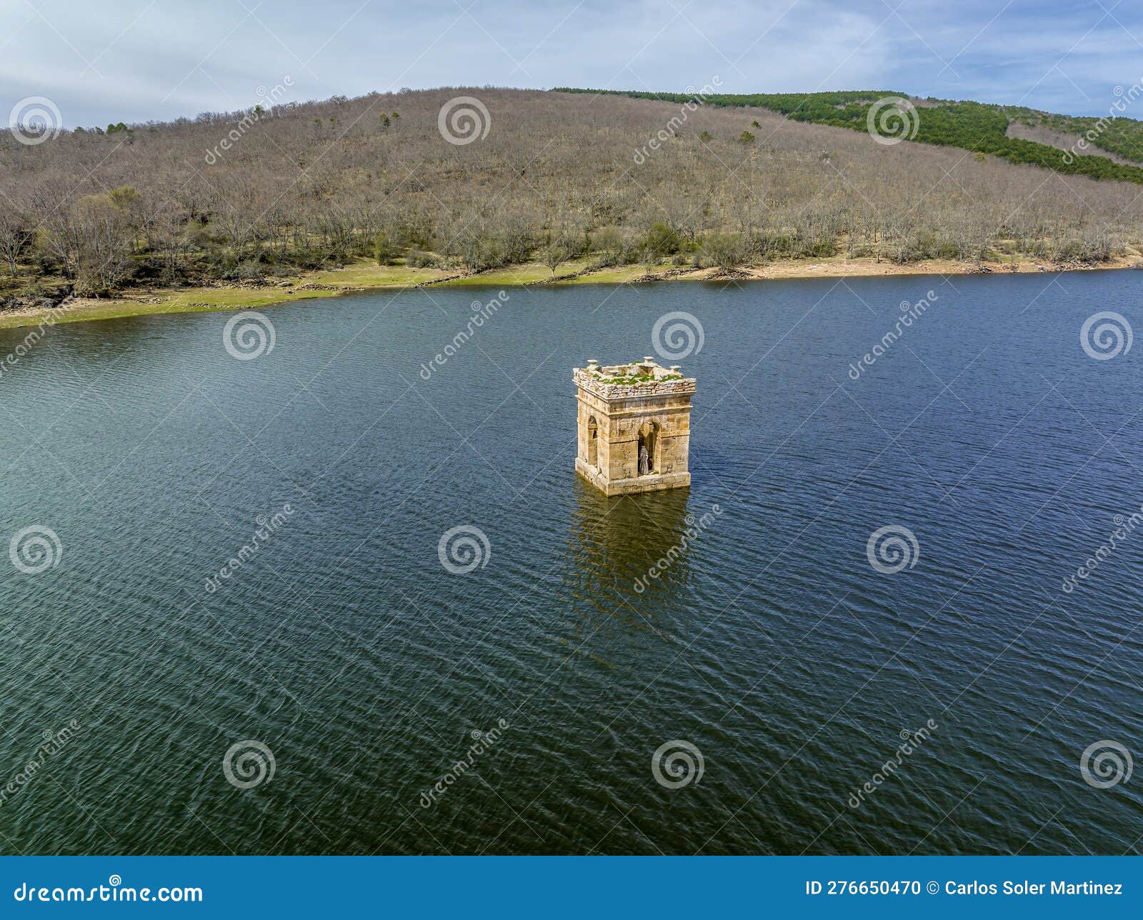 cuerda del pozo reservoir the bell tower of the church of la muedra soria province