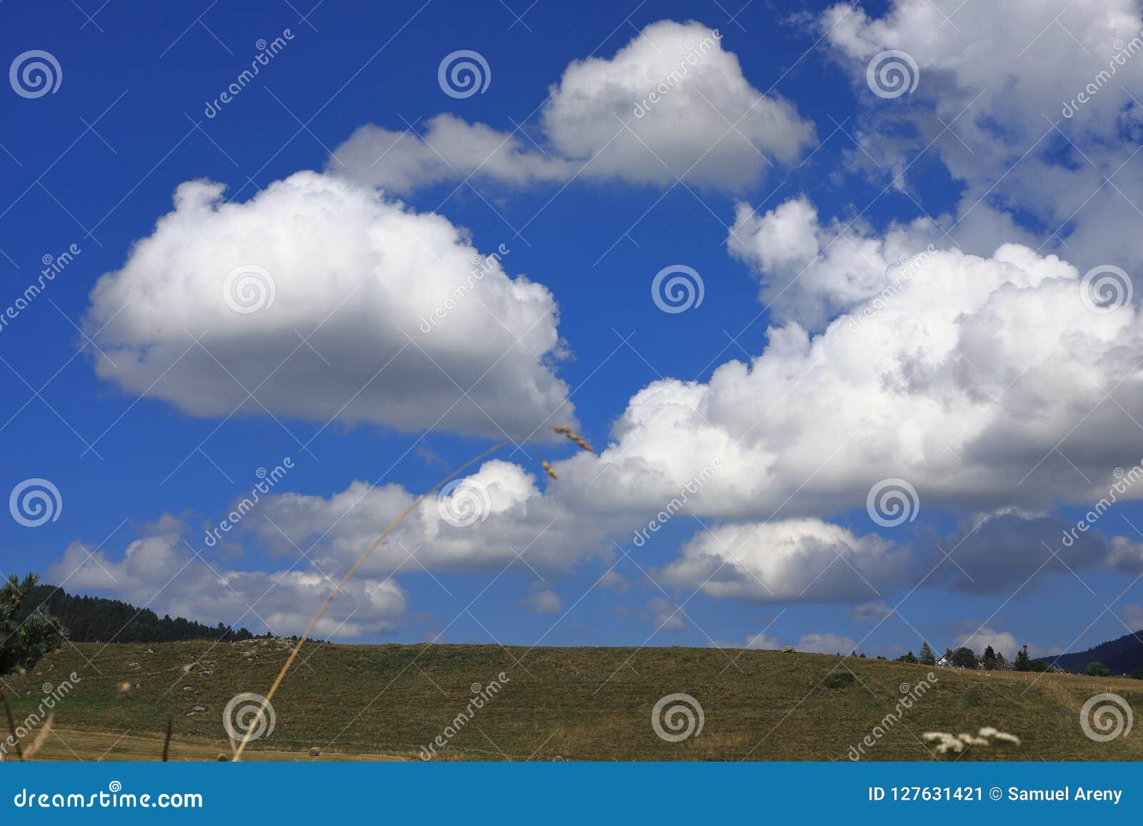 cumulo nimbus clouds and pyrenean landscape, france