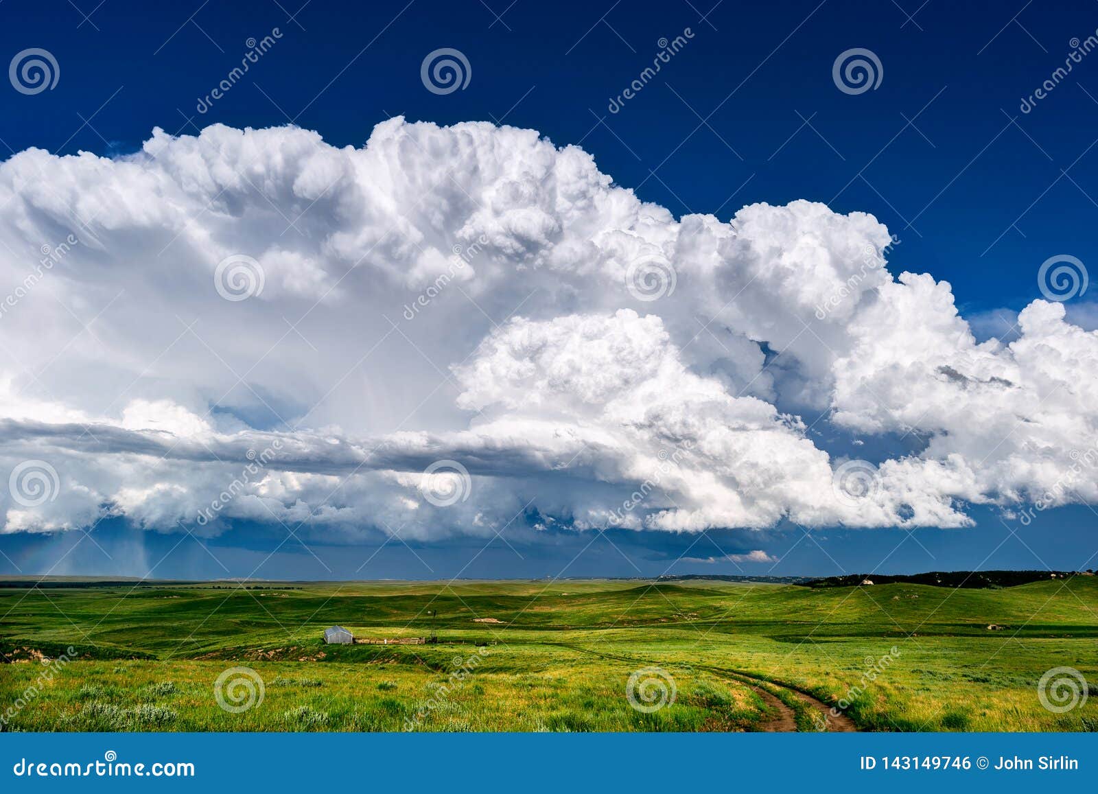 cumulonimbus thunderstorm clouds with wyoming landscape.