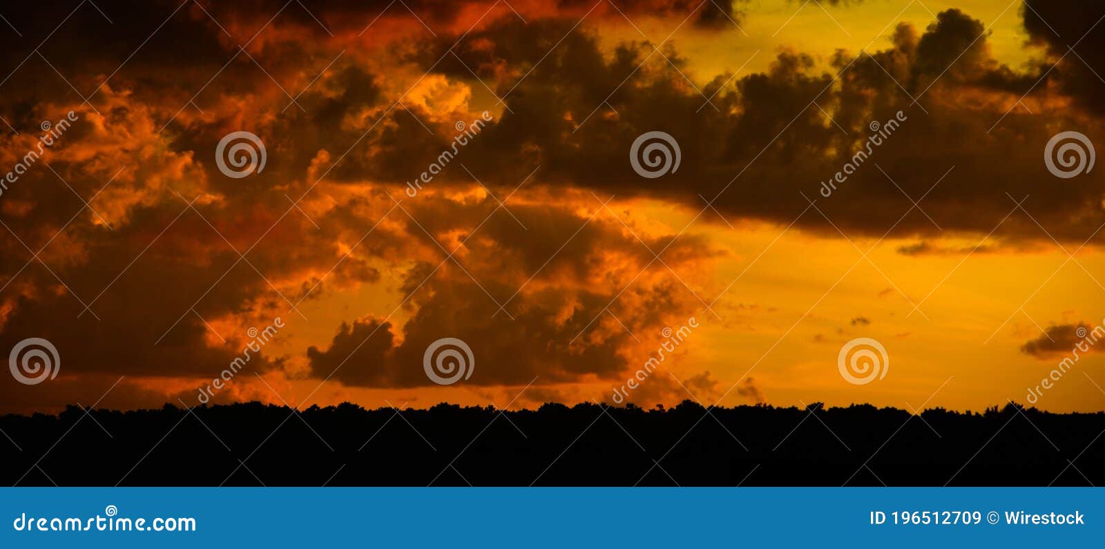 cumulus and cumulonimbus clouds at sunset