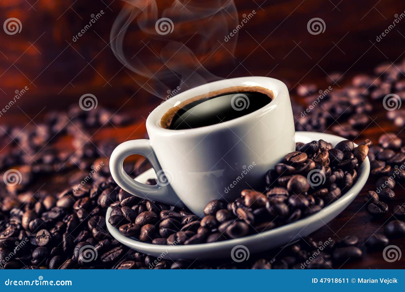 Cup Of Black  Coffee  And Spilled Coffee  Beans  Stock Image 