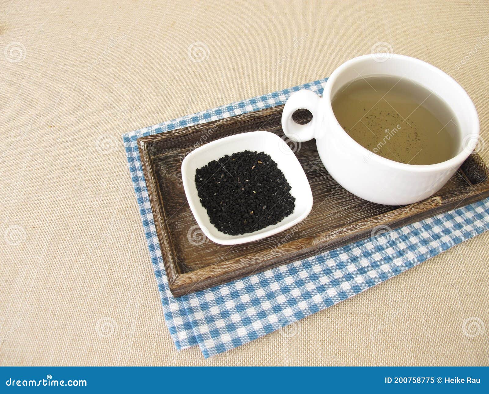 A cup of black cumin tea stock image. Image of warmth 200758775