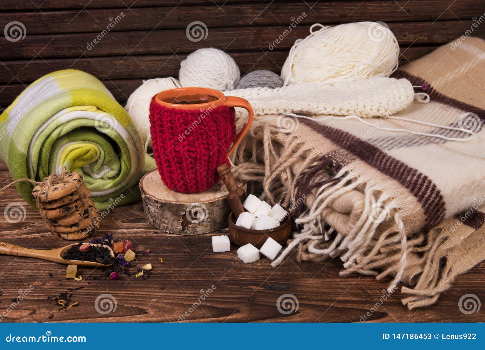 A Cup with a Blanket, Knitting Threads on the Table. Cup in Red Knitted ...