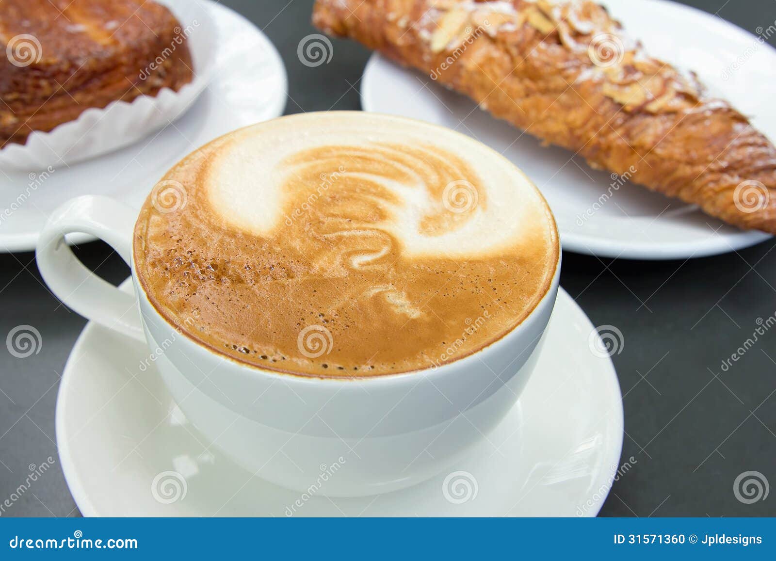 cup of caffe latte with pastry