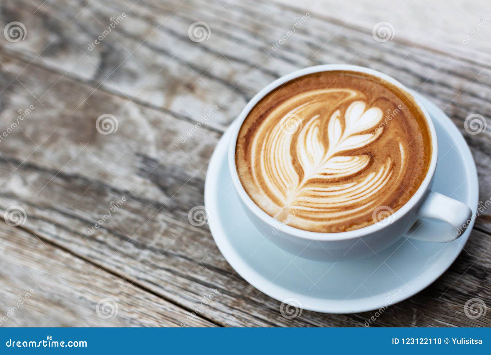 a cup of cappuccino with latte art