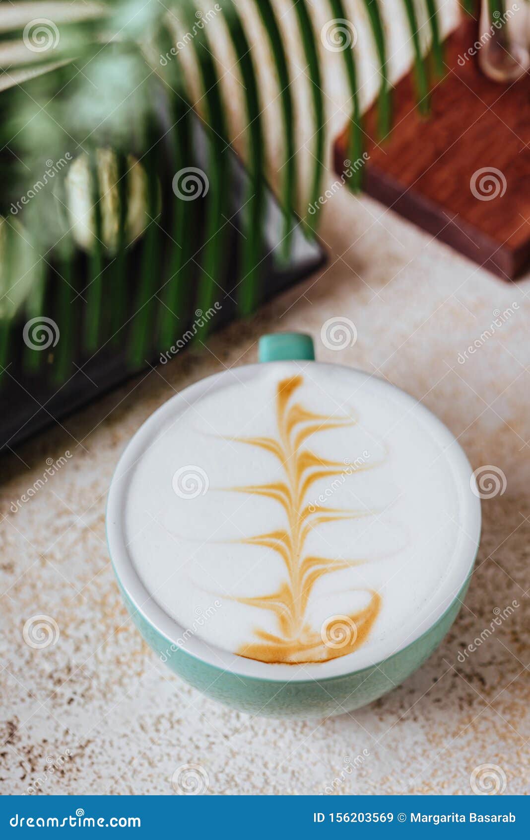 https://thumbs.dreamstime.com/z/cup-cappuccino-set-modern-exotic-accessories-palm-leaf-fresh-156203569.jpg