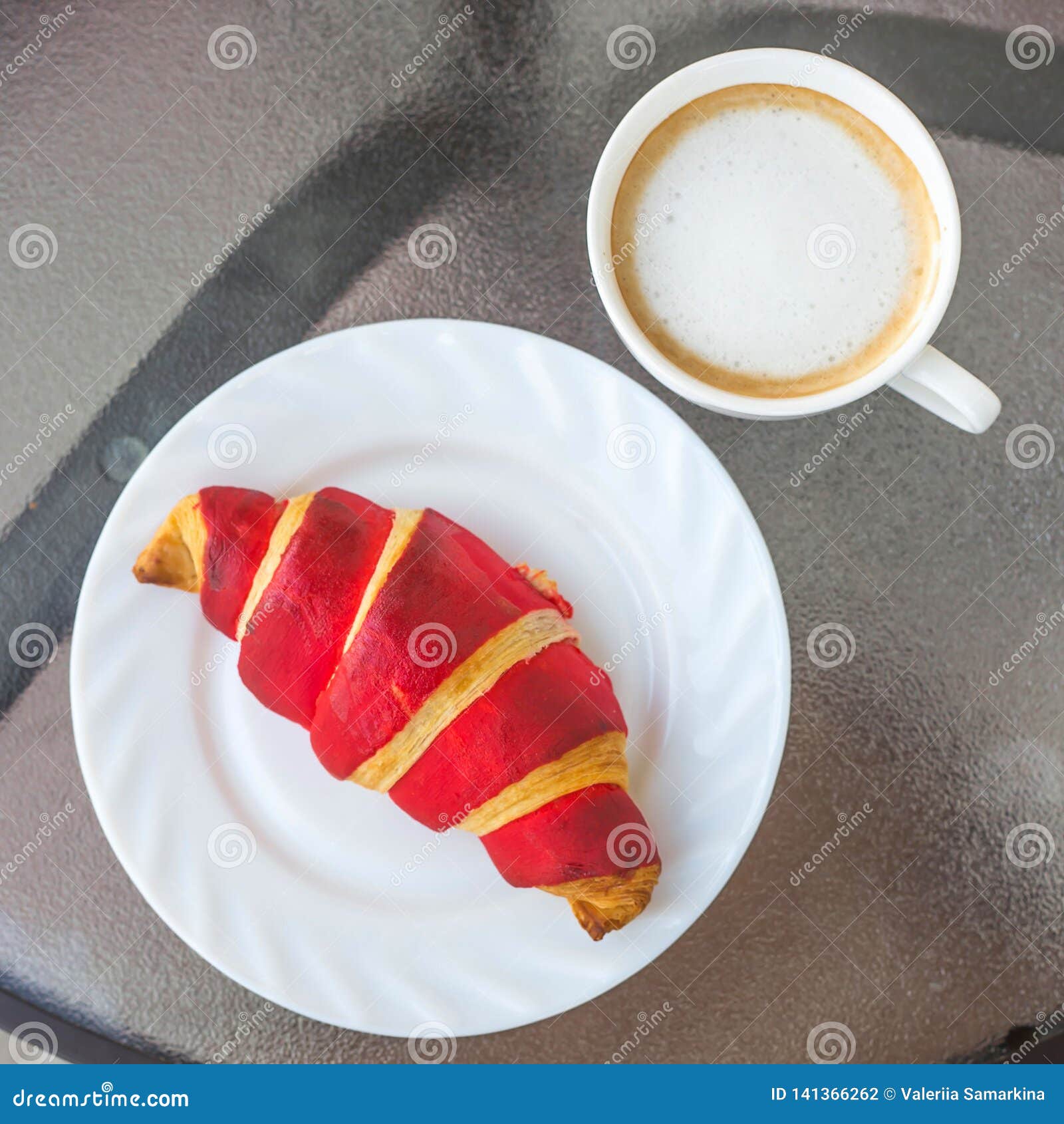 Croissant and a cup of tea French breakfast, Stock image