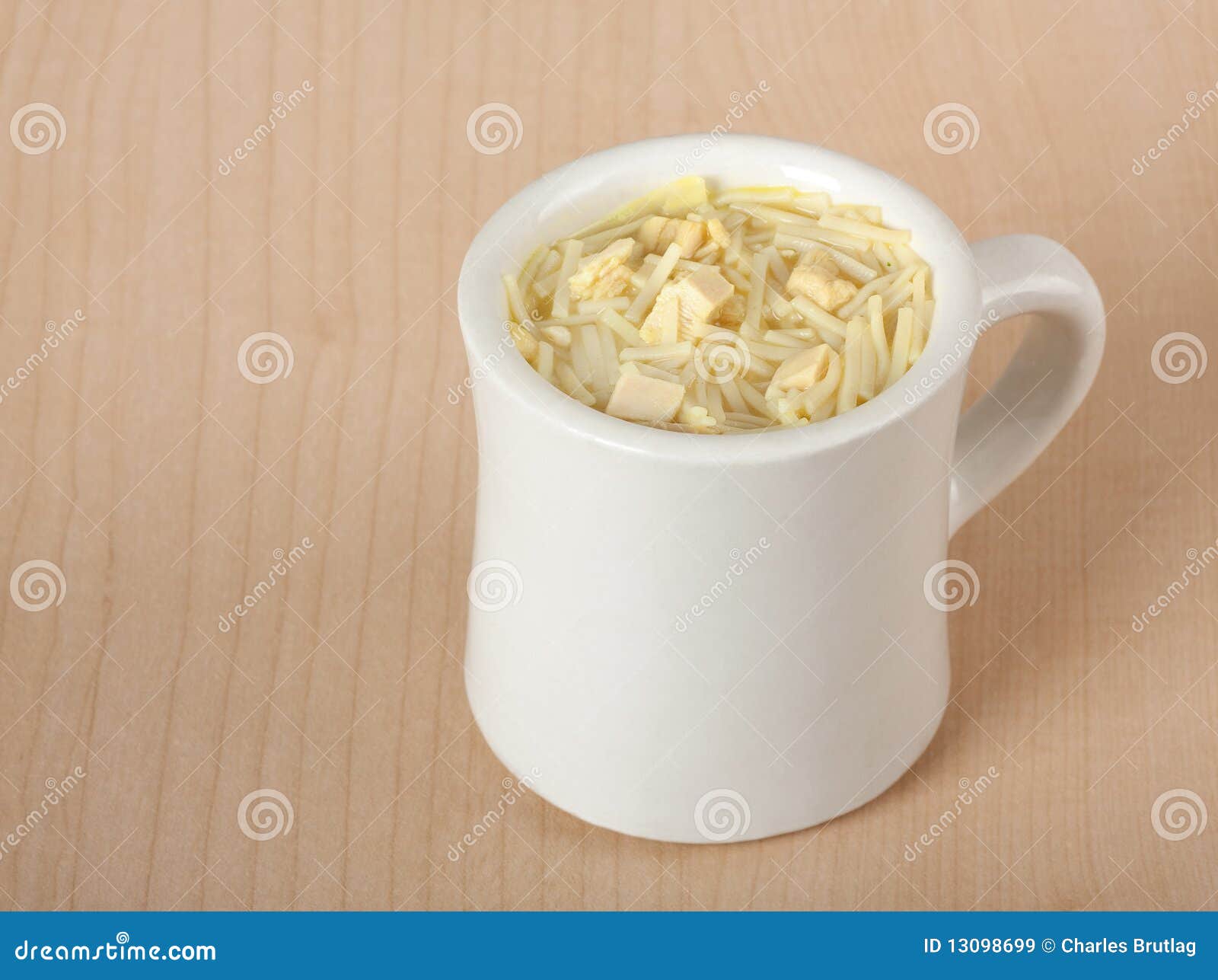 Cup of Chicken Noodle Soup stock image. Image of table - 13098699