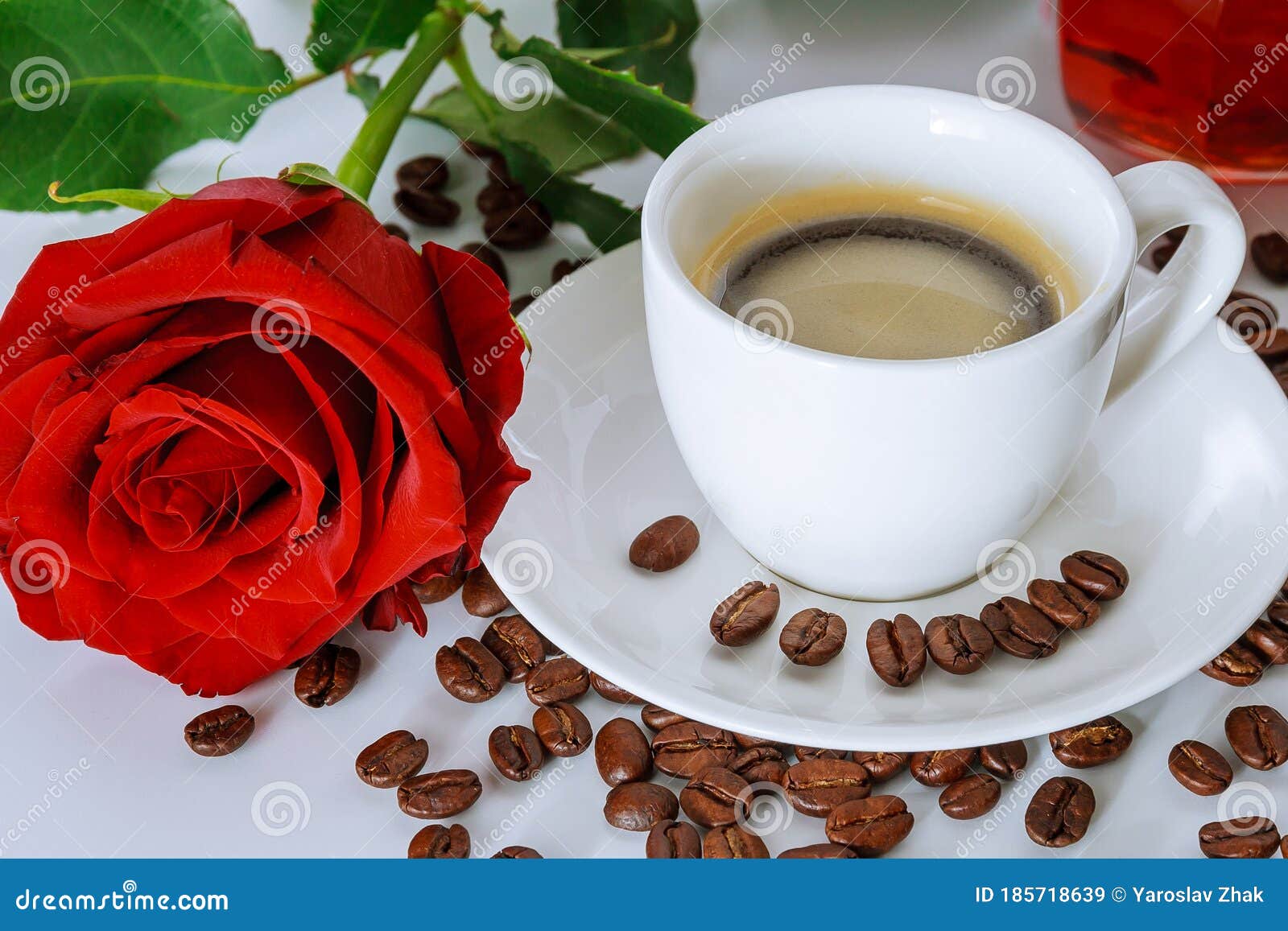 Cup of Coffee and a Bouquet of Red Roses. Coffee Beans Scattered ...