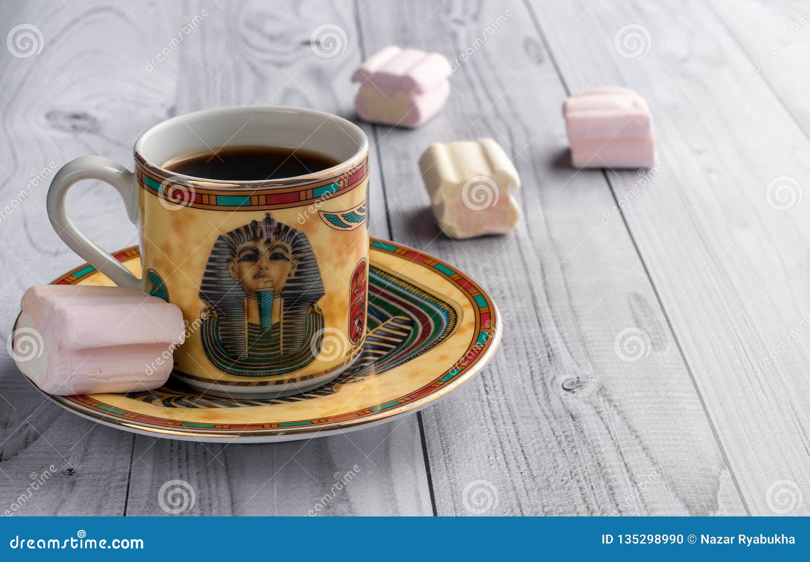 A Cup of Coffee with Egyptian Patterns and Sweet Marshmallows on a