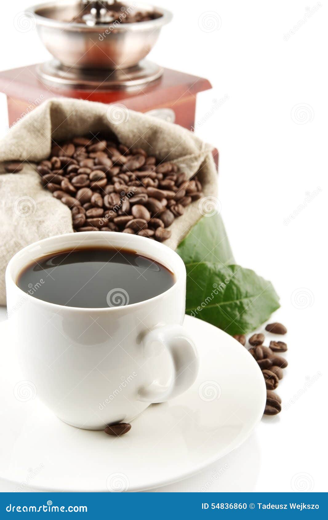 cup of coffee with mill,bag full of coffee beans on white