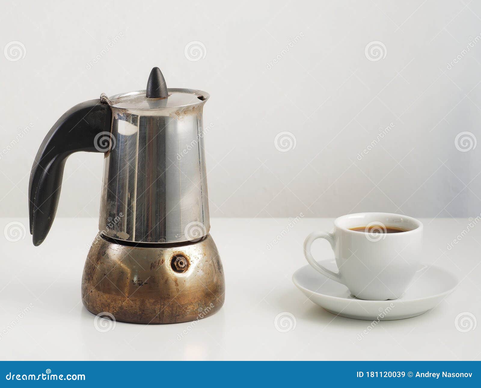 Cup and Coffee Pot with Coffee on White Table Stock Image - Image