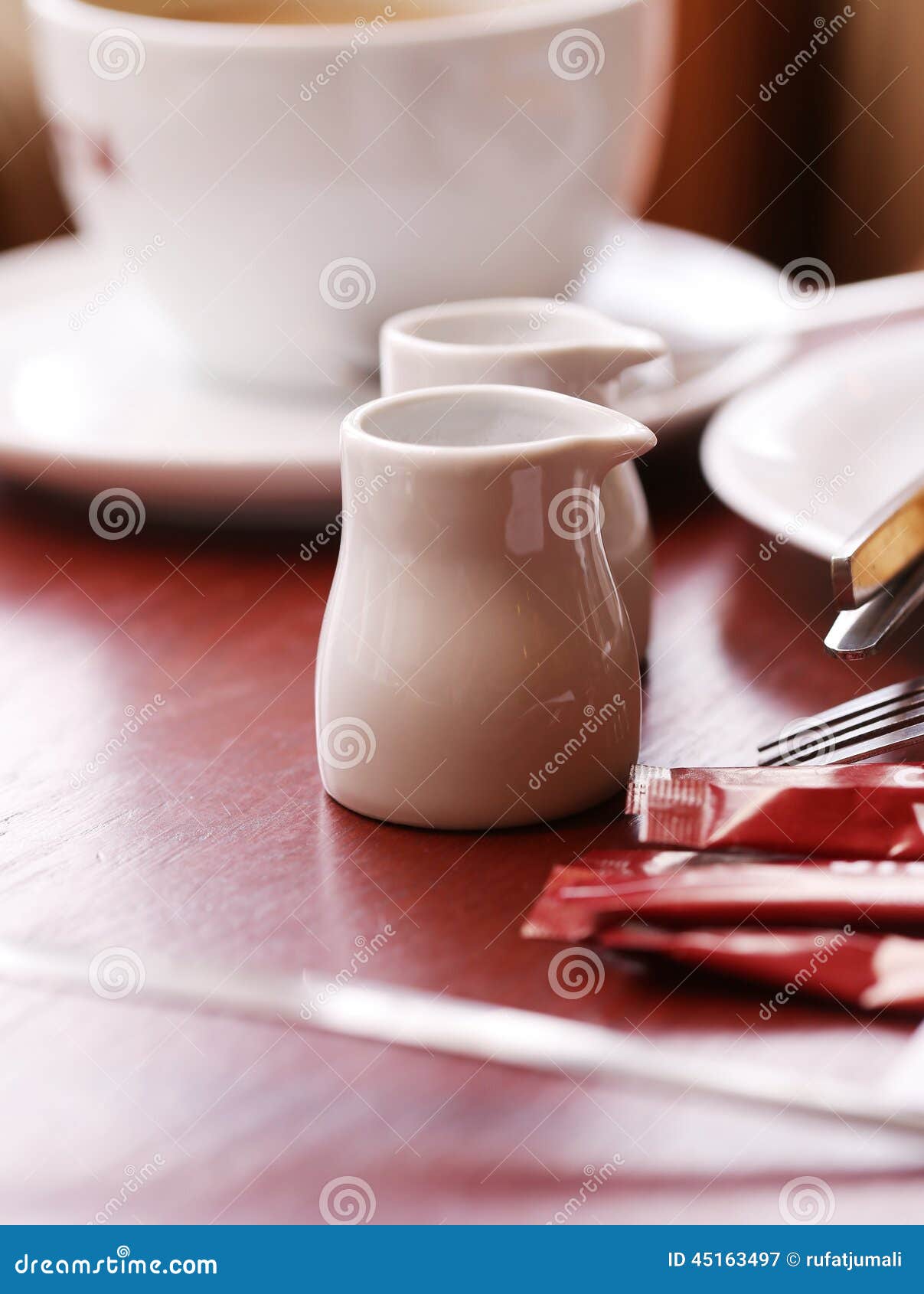 A Cup of Coffee and Some Teapots Stock Image Image of blur, black