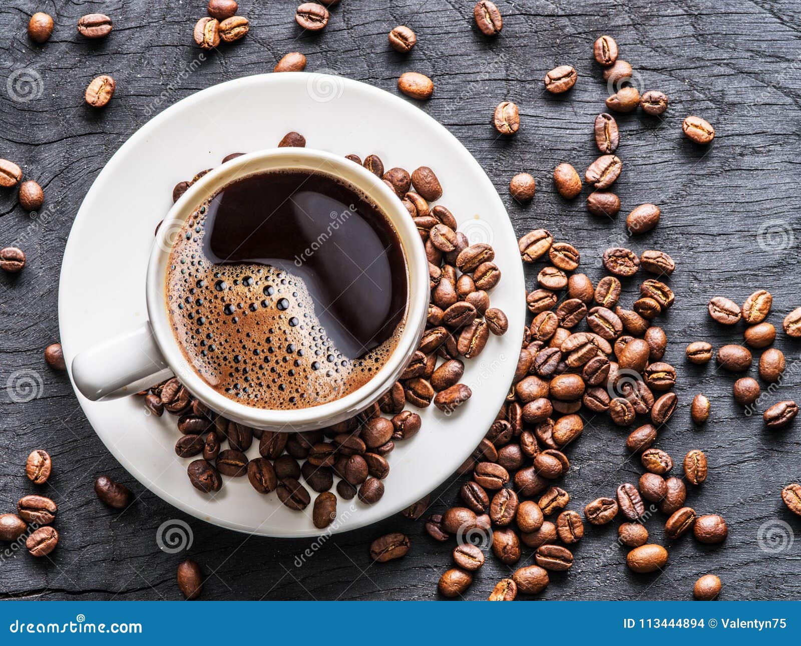 Cup of Coffee Surrounded by Coffee Beans. Top View Stock Photo Image