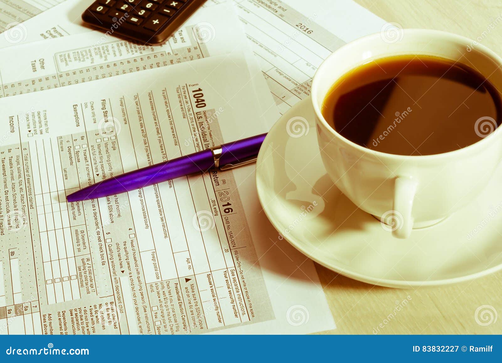 Cup of coffee and tax form editorial photography. Image of season