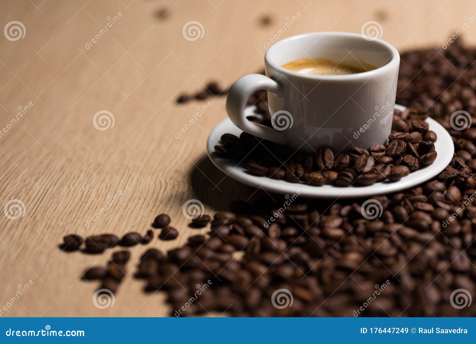 cup of coffee on a wooden table with natural coffee