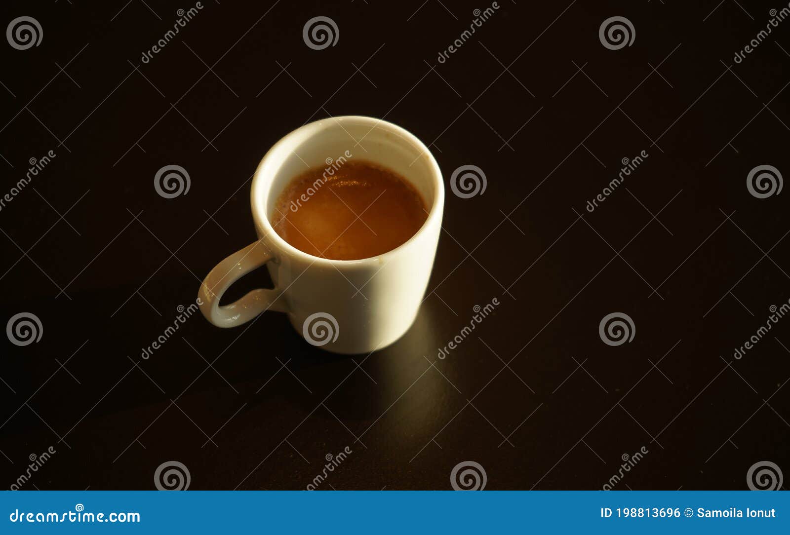 cup of espresso placed on the table