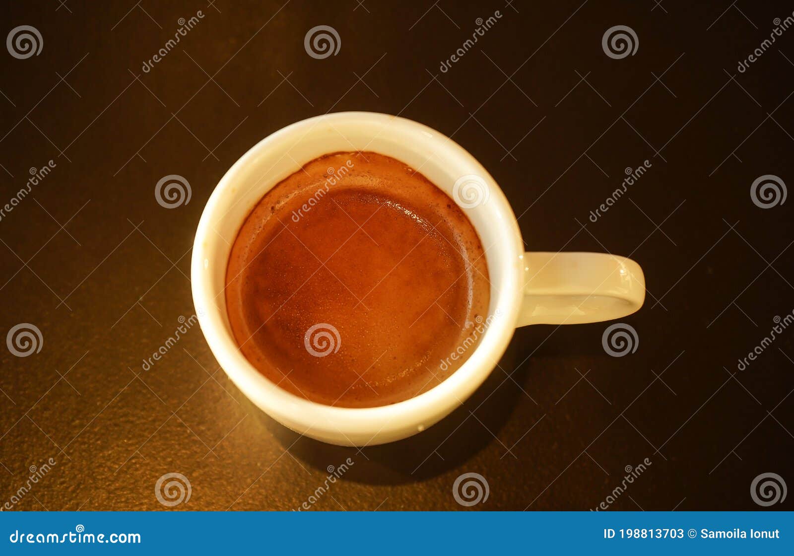 cup of espresso placed on the table