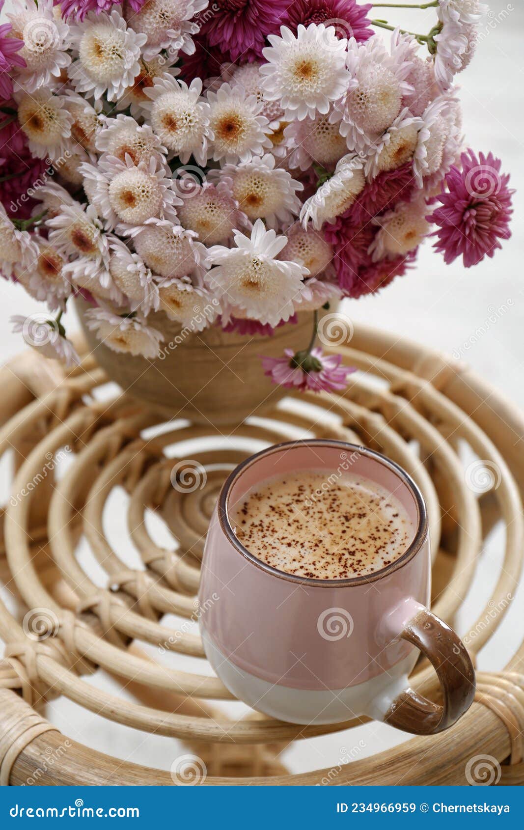 Cup of Fresh Coffee and Beautiful Bouquet on Wooden Stand. Good ...