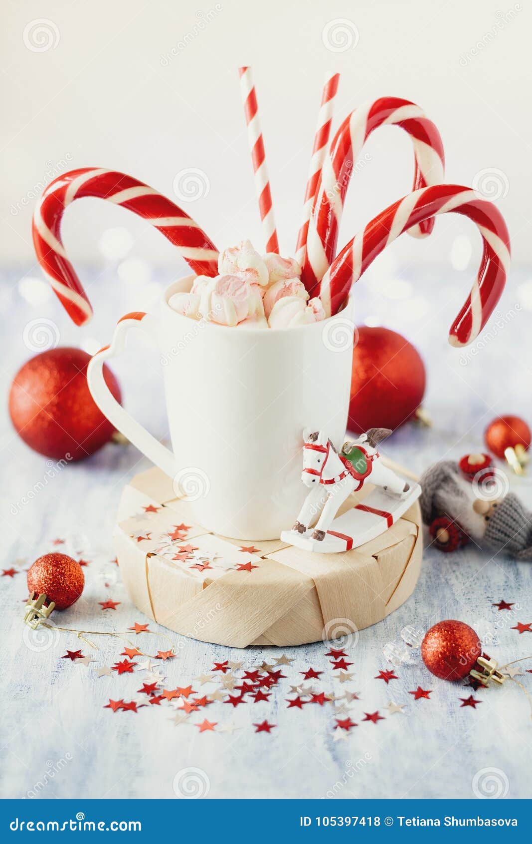 https://thumbs.dreamstime.com/z/cup-hot-cocoa-marshmallows-candy-canes-blue-rustic-background-christmas-lights-bokeh-cup-hot-cocoa-105397418.jpg