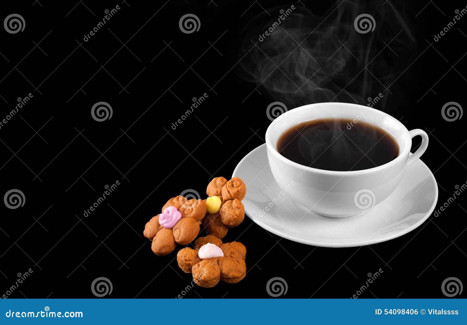 A cup of hot coffee and cookies isolated on a black background. Steam