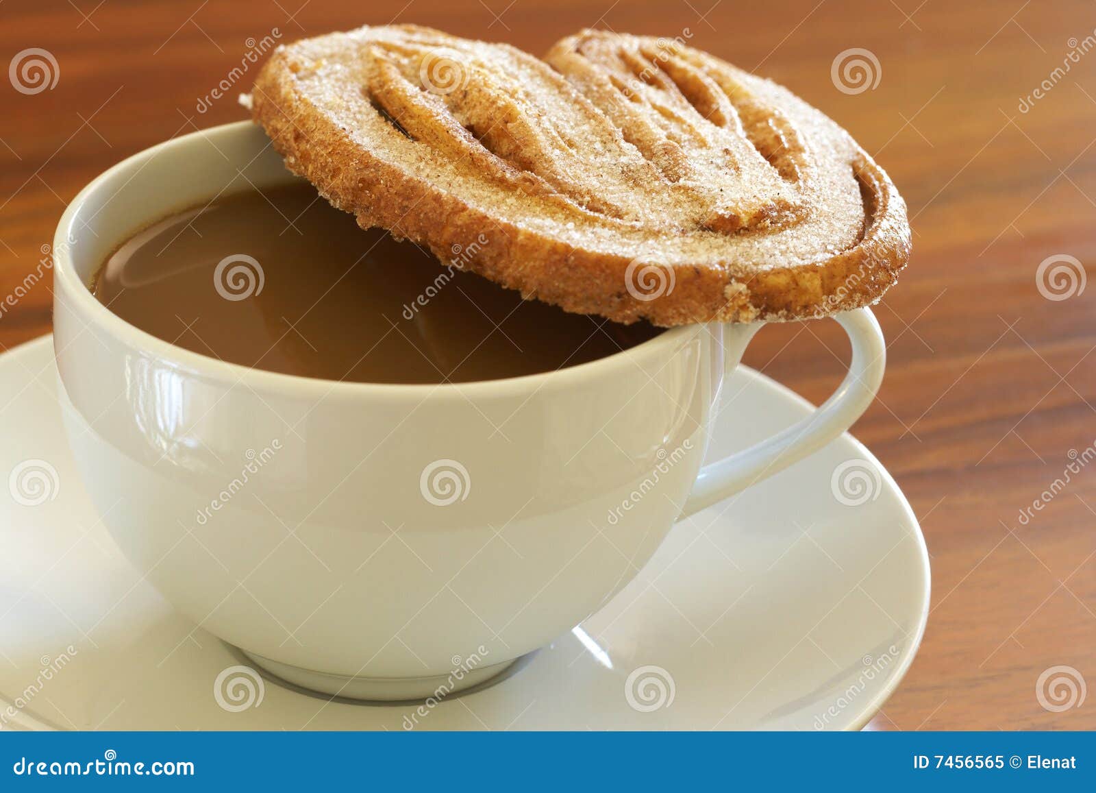 cup of hot coffee and palmier cookie