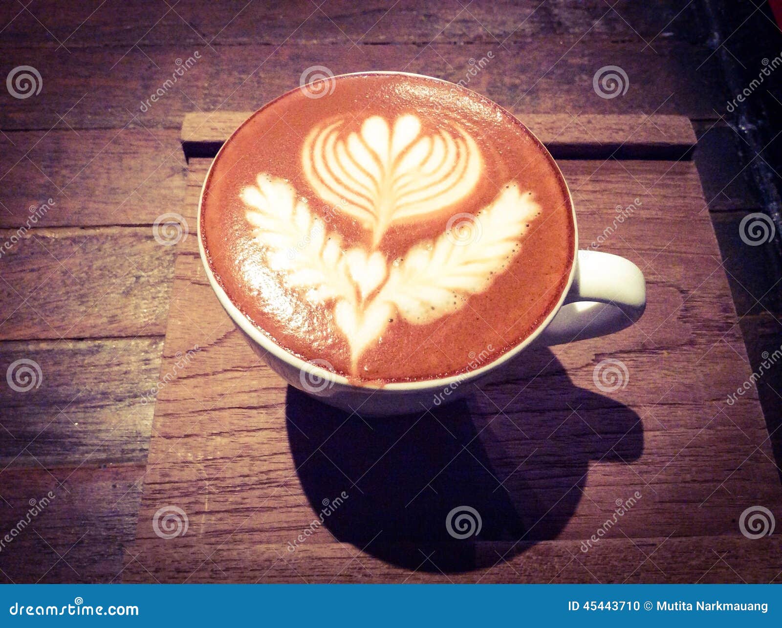 cup of hot latte or cappuccino with fascinating latte art