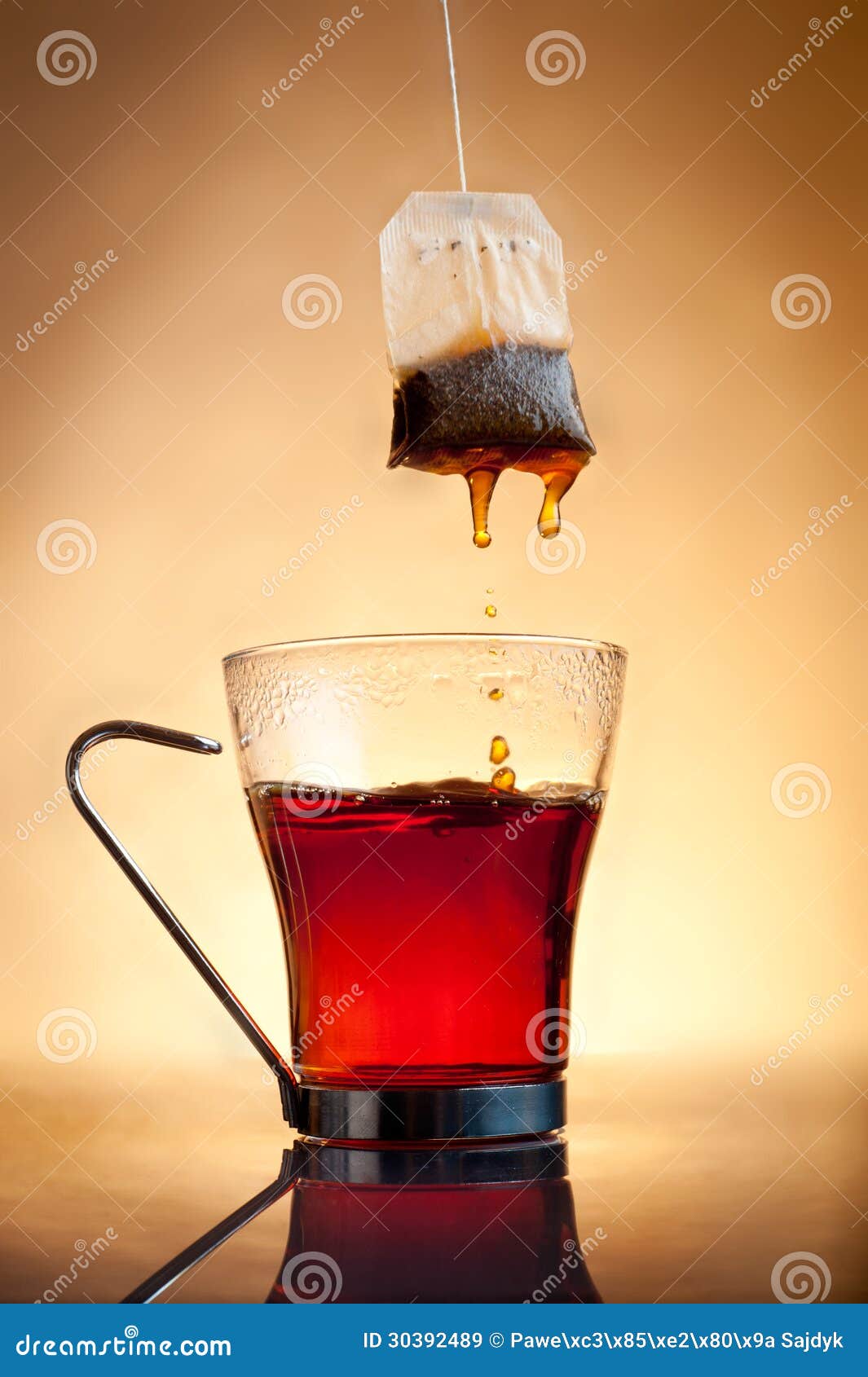 Cup of hot tea with teabag stock image. Image of steam 30392489