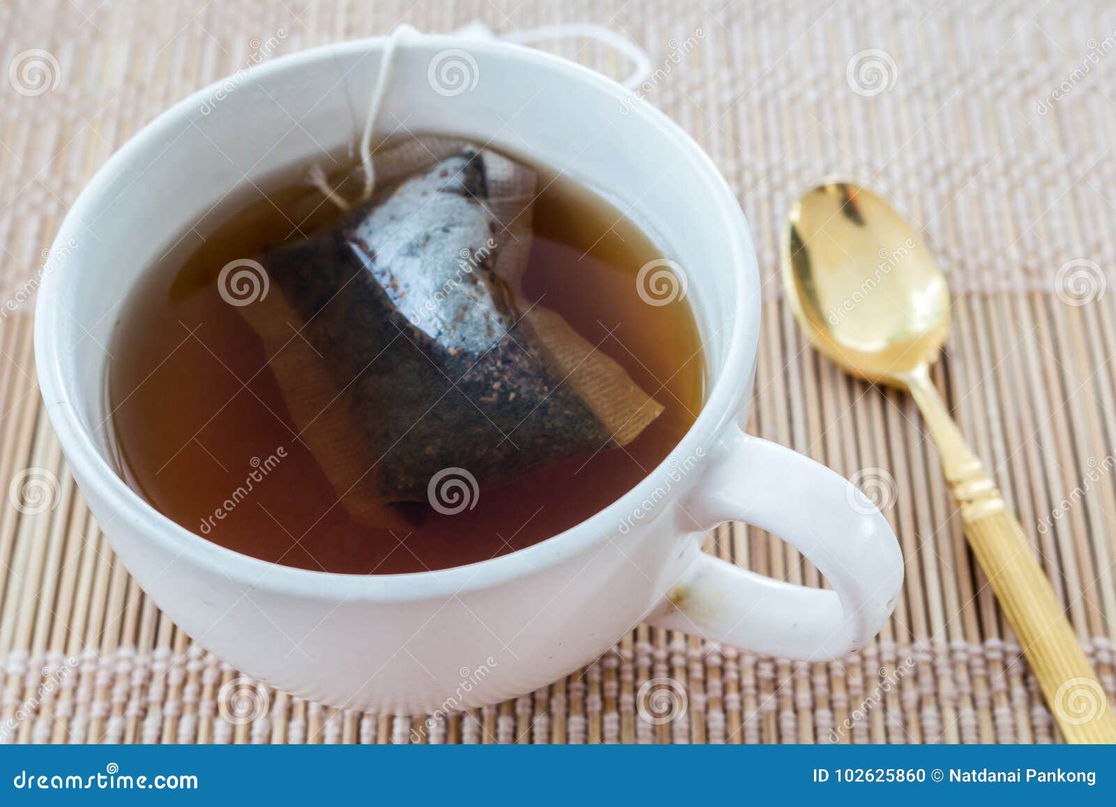 Cup of tea with tea bag stock photo. Image of health 102625860