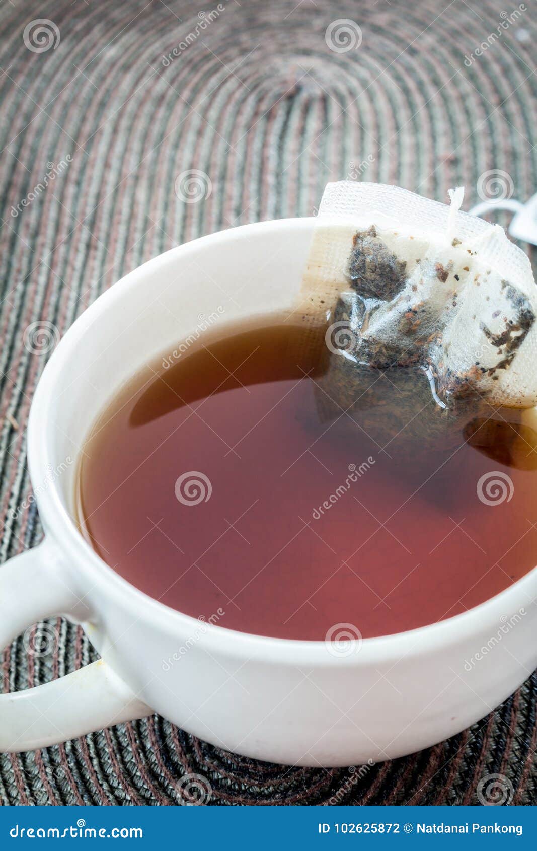Cup of tea with tea bag stock photo. Image of heat, background 102625872