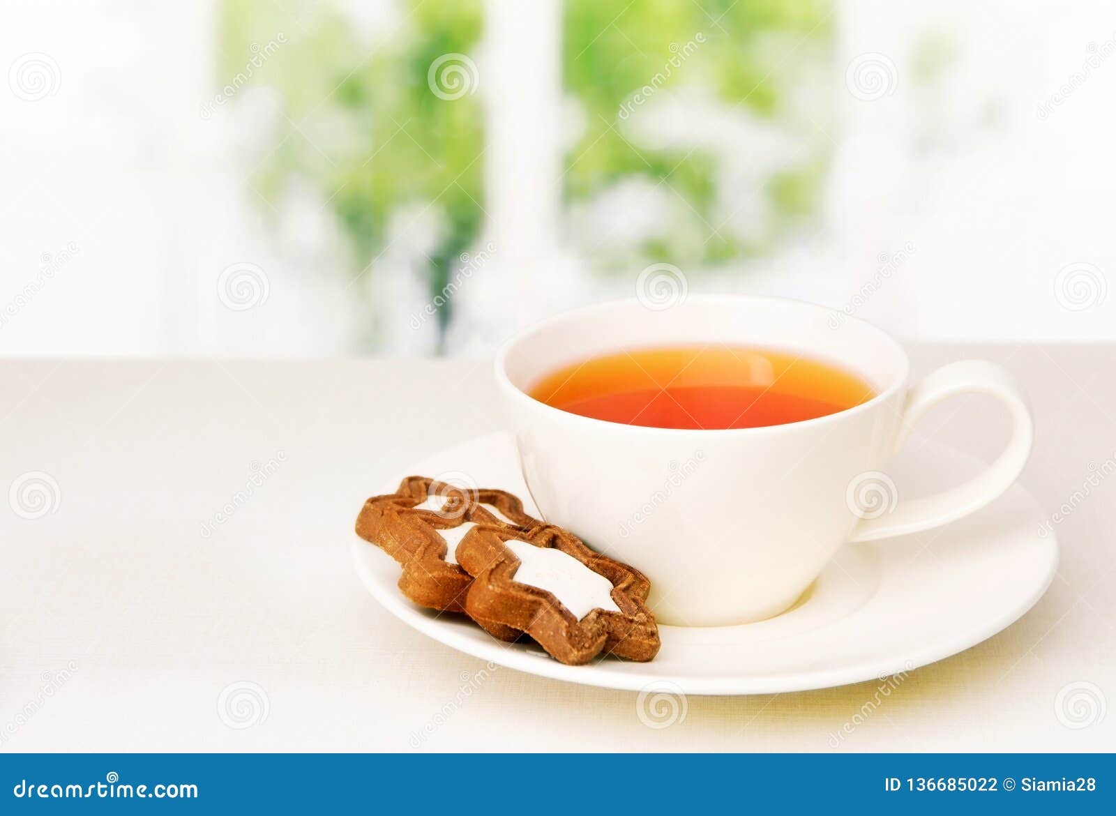Cup with Tea and Biscuits on a Saucer on the Table Stock Photo Image