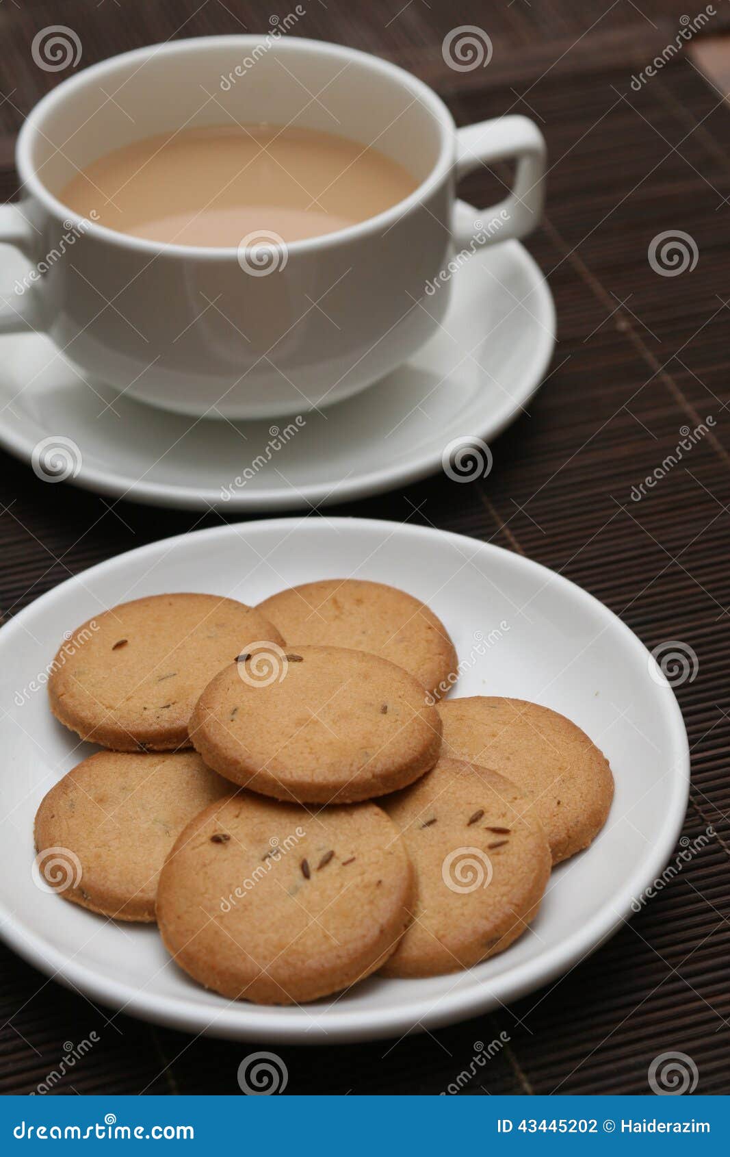 A cup of tea with biscuits stock photo. Image of biscuit 43445202