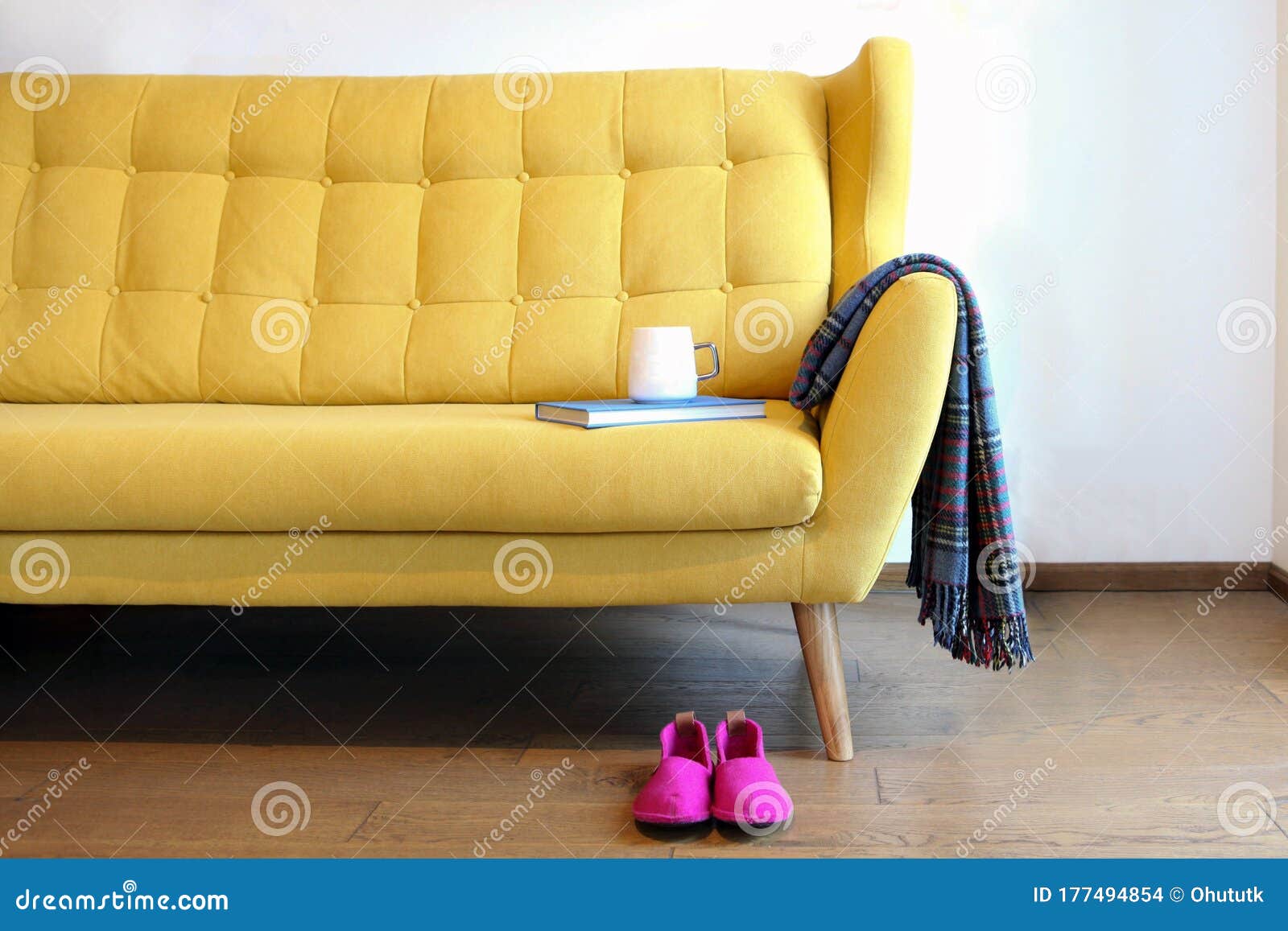 Cup of Tea and Blue Book on a Yellow Coach. Still Life Details in Home  Interior of Living Room Stock Photo - Image of blanket, furnitured:  177494854