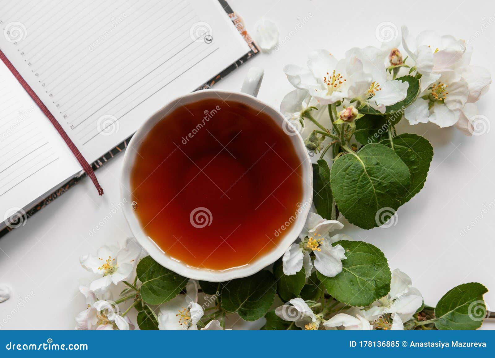 A Cup of Tea and a Diary on the Table. Stock Image Image of black