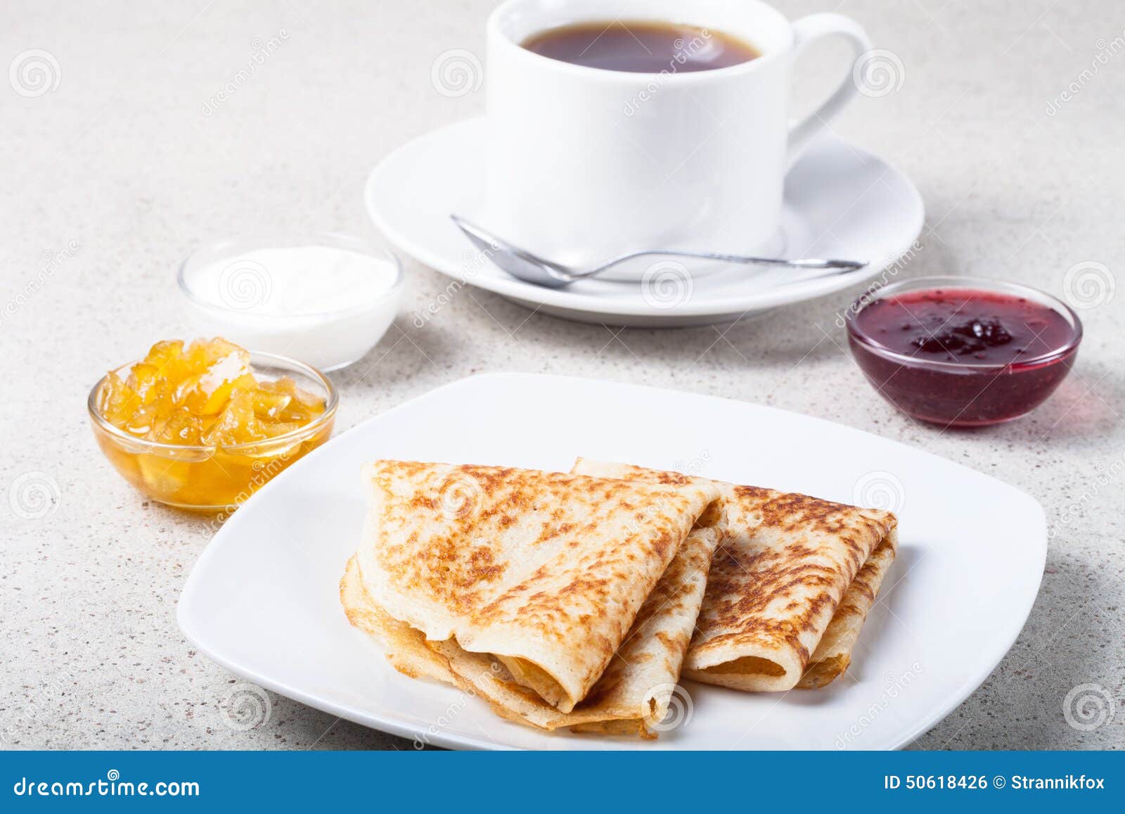 Cup of Tea with Jam, Sour Cream and Russian Pancakes Blini Stock