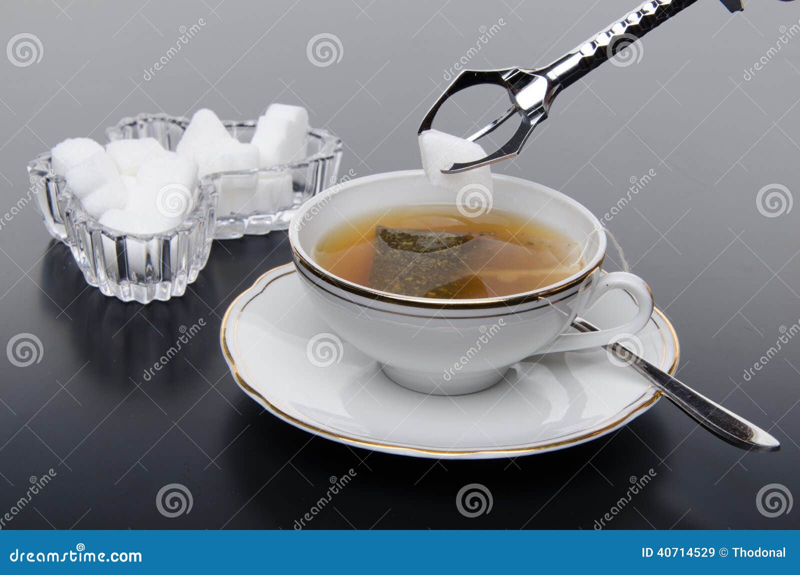 A cup of tea with sugar stock image. Image of tasty, liquid 40714529
