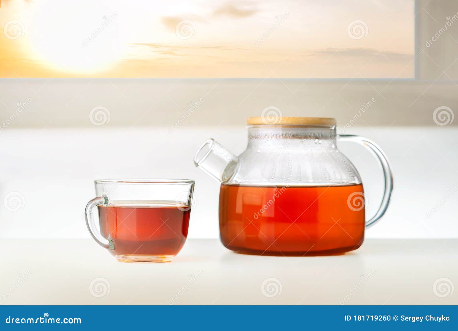 Cup of Tea and Teapot on the Table with Sun. Stock Photo Image of