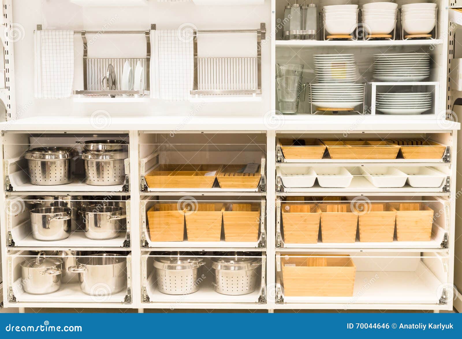 Cupboard for a Dishes with Clean Tableware on the Kitchen Stock Photo