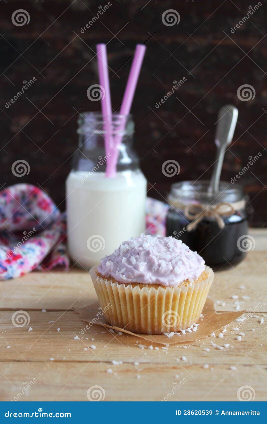 Cupcake with Blackcurrant Jam and Coconut and Cream Cheese Frosting