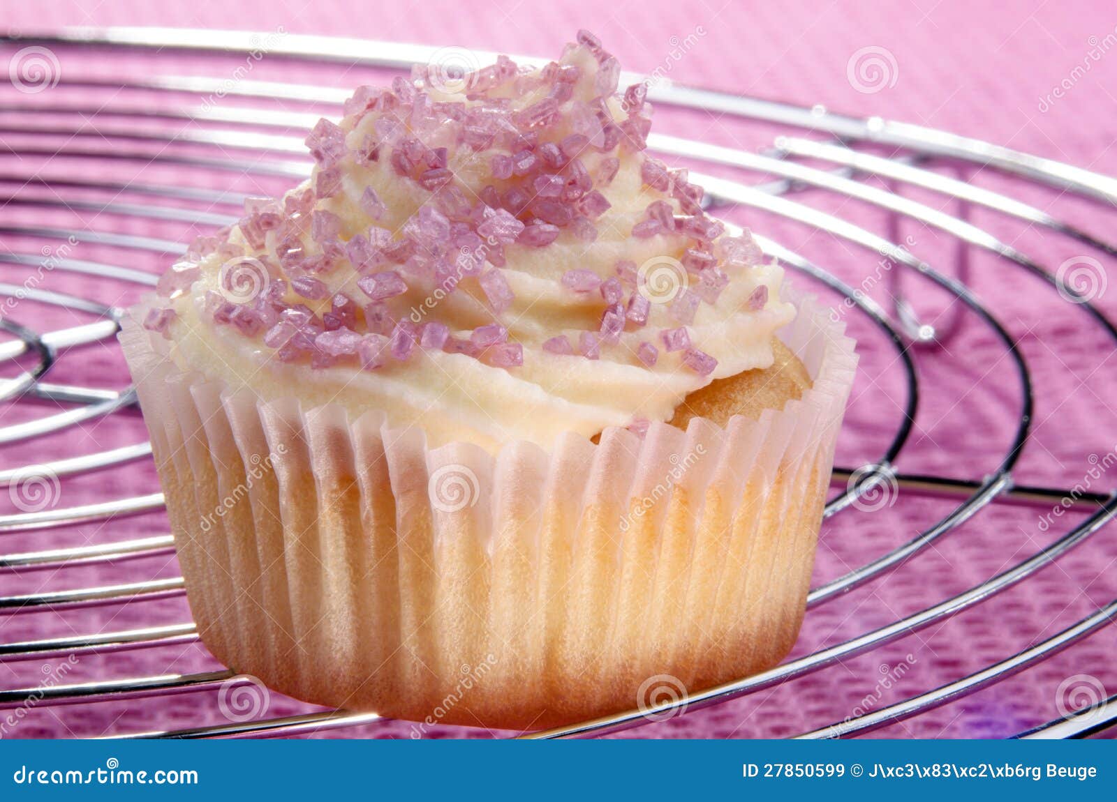 Cupcake on a cooling rack stock image. Image of home 27850599